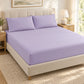 Forro ajustable liso con 2 sobrefundas bordadas, color Lila – forro ajustable y 2 sobrefundas en la cama