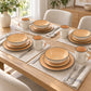 Mesa montada con la vajilla Lotus color Durazno para 4 personas