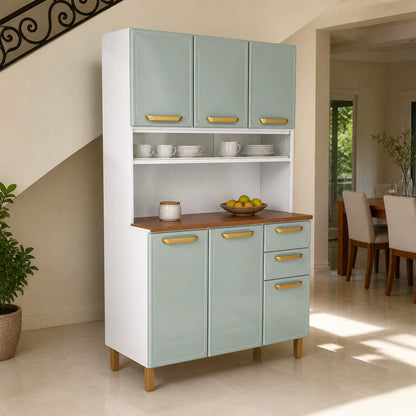 Alacena de cocina Bertolini verde menta ambientada en un pasillo interior, con tazas y platos exhibidos en la vitrina corrediza y frutas sobre el tablero