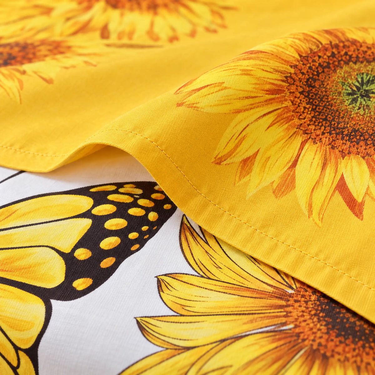 Juego de sábanas con vuelo 4 piezas, diseño Girasoles y Mariposas Amarillas – detalle de la tela