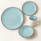 Vista superior de un puesto de la vajilla Lotus color Celeste: plato llano, plato de postre, tazón y taza