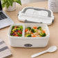 Lonchera eléctrica LOTUS gris abierta con almuerzo caliente y ensalada
