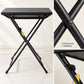 Detalle de la estructura metálica con patas cruzadas de la mesa plegable