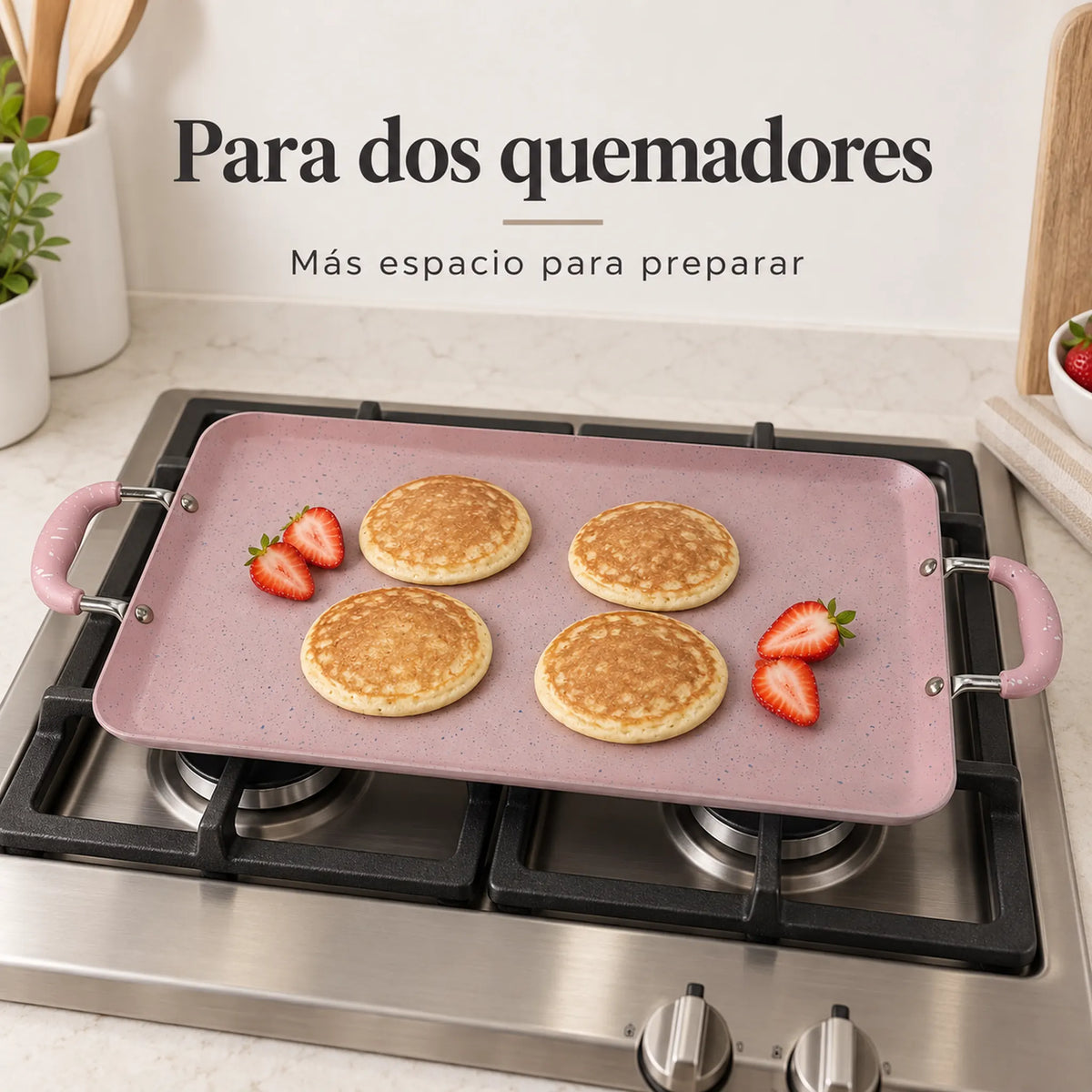 Plancha doble ROCA en uso sobre dos quemadores, color Rosa Marmoleado
