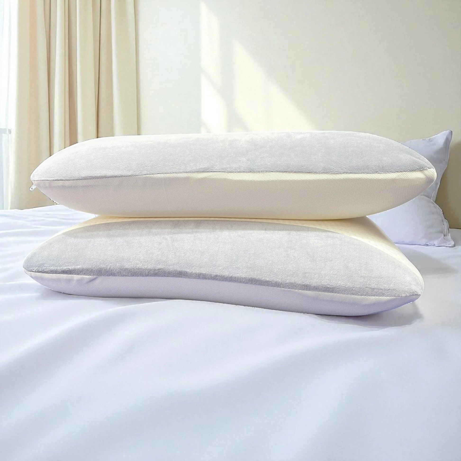 Perfil lateral de dos almohadas Casa Opal 35x55 cm, memory foam blanco con gris, apiladas para resaltar altura y soporte cervical.