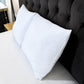 Dos almohadas refrescantes Pacific Home blancas con diseño celeste colocadas sobre una cama junto a una cabecera negra.