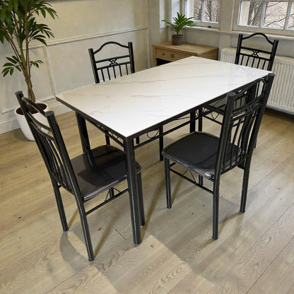 Comedor 4 puestos Ambienta Home Decor DT-Y7007 con mesa rectangular 120x70 cm, cubierta tipo mármol blanco y estructura metálica negra, vista 3/4.