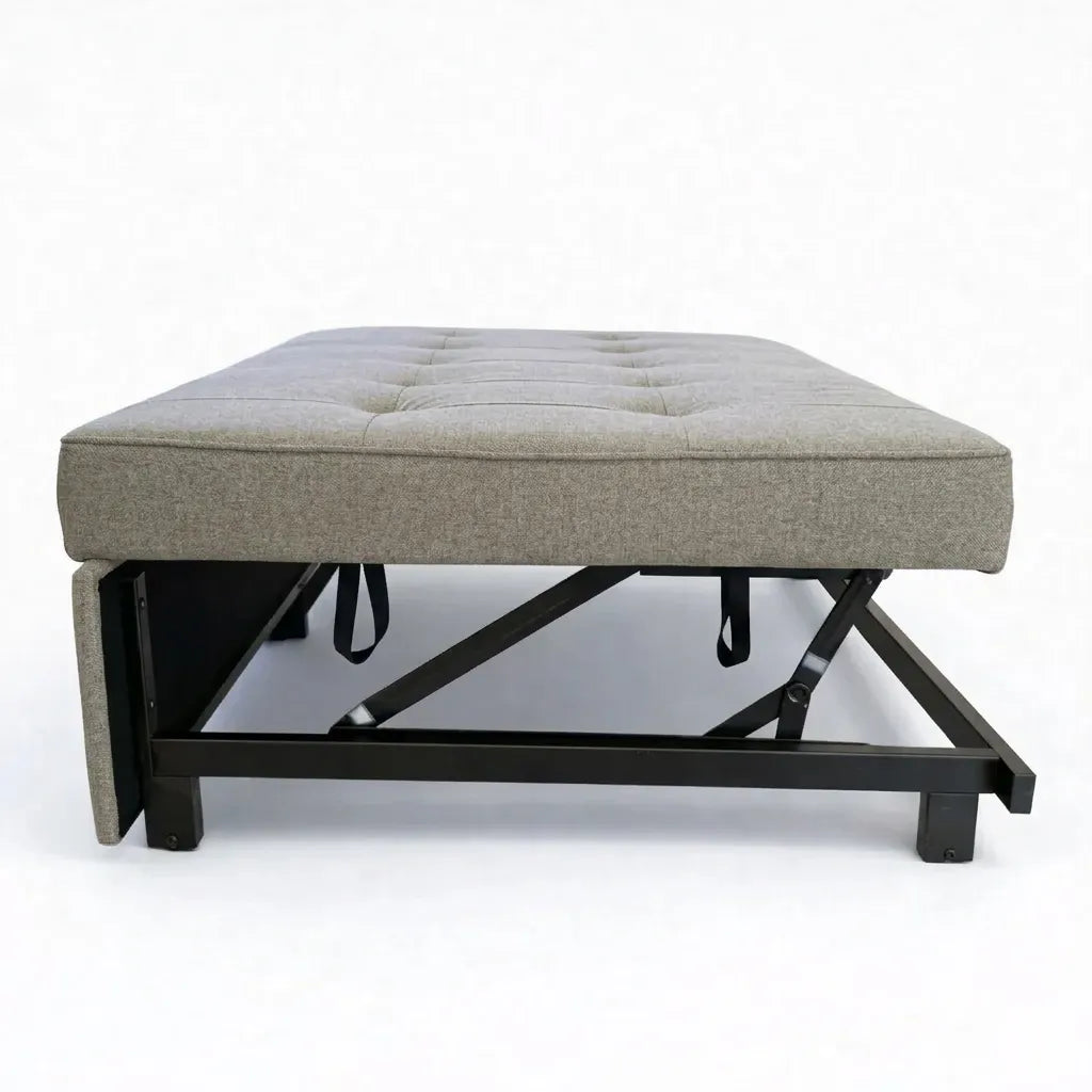Sofá cama SFB-6096 beige de Ambienta Home Decor en modo cama abierto, vista lateral con estructura metálica y sistema abatible visible, fondo blanco.
