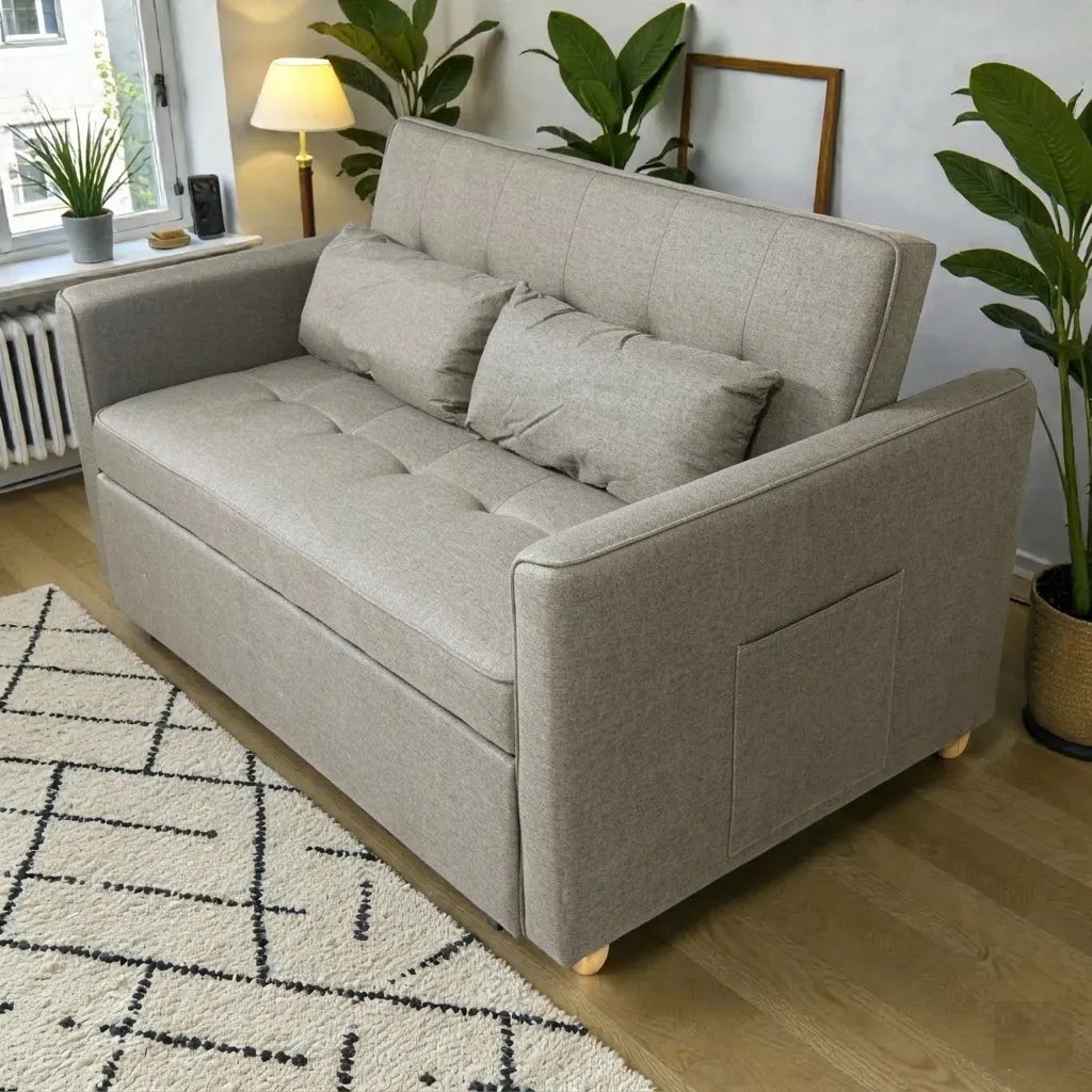 Sofá cama SFB-6096 beige de Ambienta Home Decor en modo sofá, vista 3/4 lateral, diseño de dos plazas con brazos rectos e incluye 2 cojines.