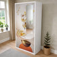 Armario con espejo de 2 puertas Ambienta Home Decor, SKU BP-2505, color blanco con diseño floral artístico en tonos dorado, beige y naranja, espejo vertical integrado, medidas 185x90x45 cm, vista frontal en ángulo.