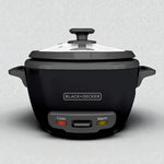 Olla arrocera BLACK+DECKER RC514 14 tazas cocidas, color negro con tapa de vidrio y luces indicadoras Cook y Warm en el panel frontal.