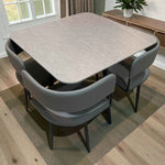 Comedor de 4 personas Ambienta Home Decor SKU 41389 con mesa cuadrada 90x90 en color gris piedra y 4 sillas grises, vista diagonal trasera