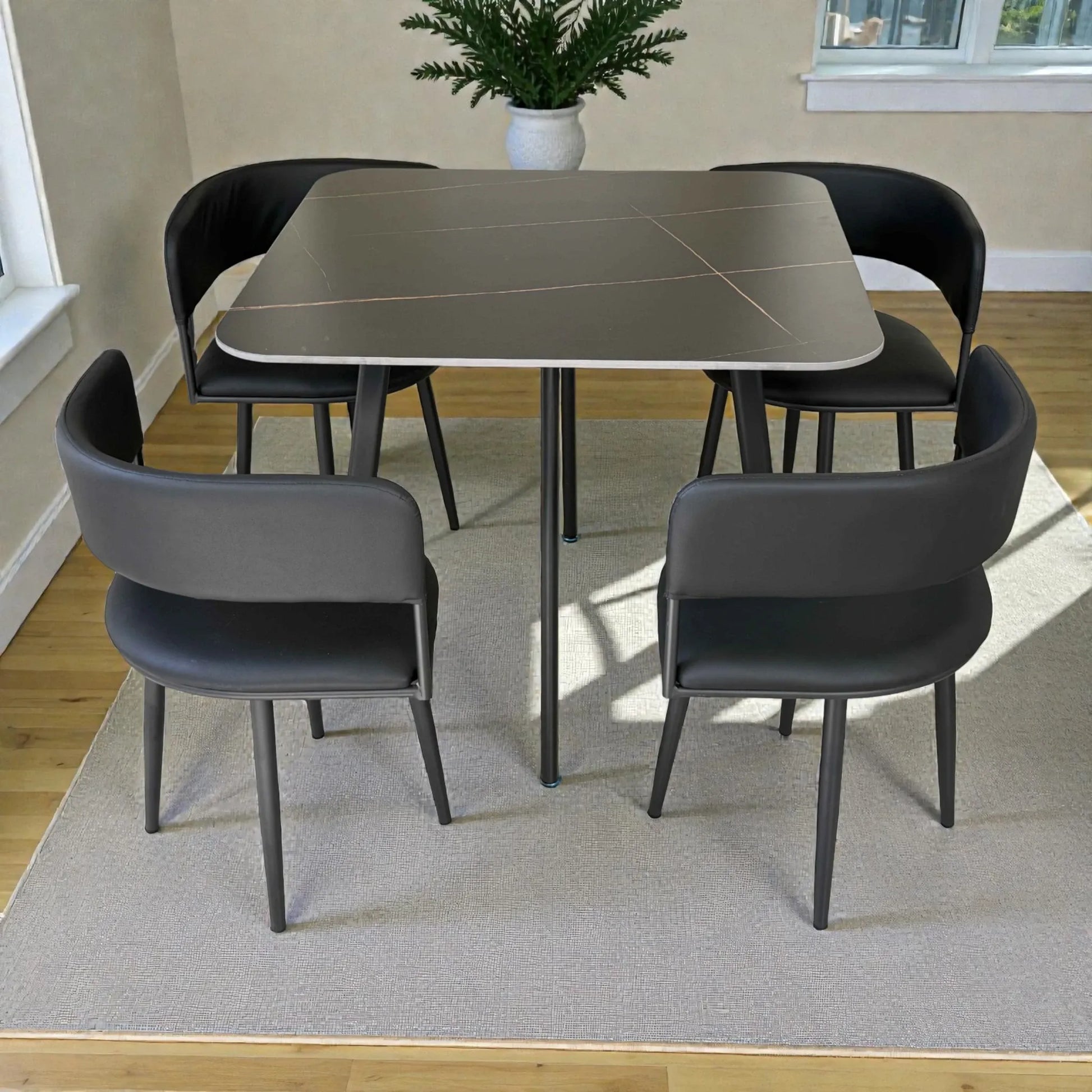 Vista trasera de comedor 41388 negro con sillas de respaldo curvo y mesa tipo mármol