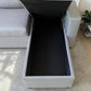 Detalle del cajón de almacenamiento del sofá cama gris claro Ambienta Home Decor, interior negro amplio, tapa levantada y estructura lateral tapizada.