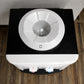 Vista superior del dispensador de agua Lotus LT-463: base circular para garrafón con boquilla central, tapa superior blanca sobre cuerpo negro (sobremesa)