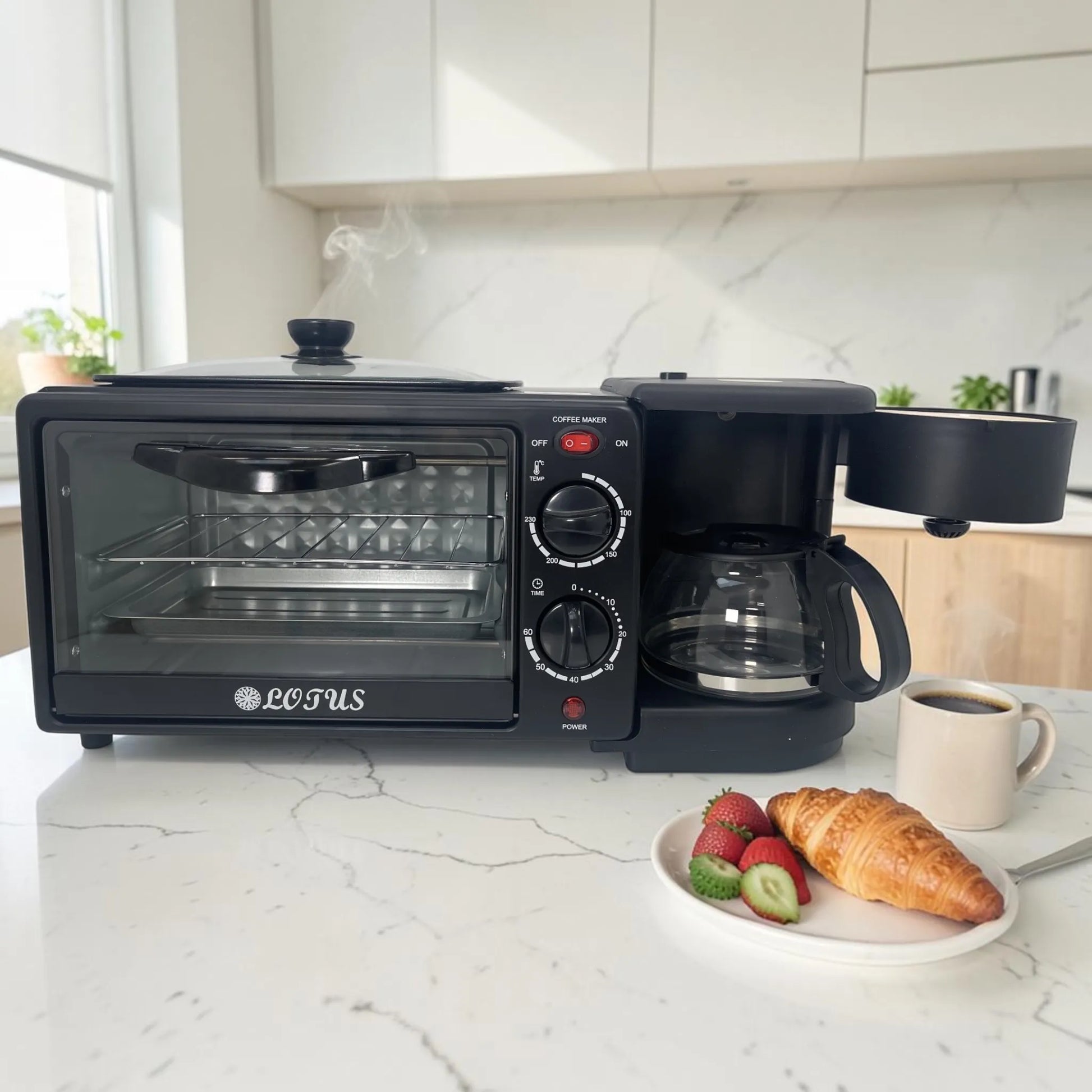 Estación de desayuno LOTUS LT-2317 negra con horno, cafetera y compartimento superior abierto en cocina moderna con desayuno servido.