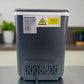Parte trasera de la Homestar HS-Z6Y1B con etiqueta de modelo, 110 V 60 Hz 112 W y adhesivo de advertencia; salida del cable en la base.