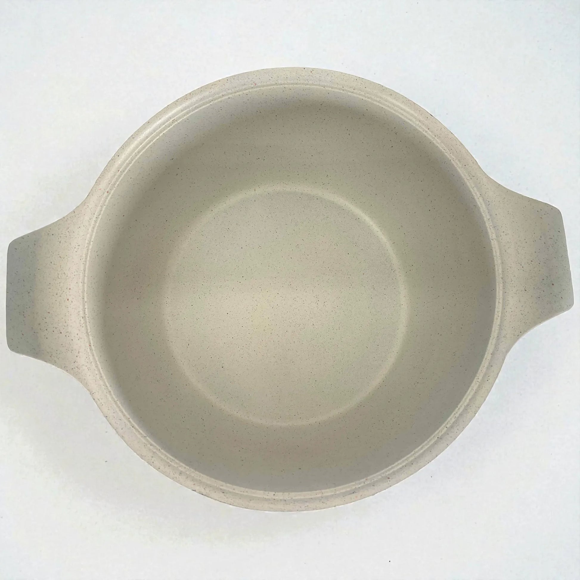 Interior antiadherente color crema tipo mármol/granito de olla HotChef, vista superior mostrando el recubrimiento interno y las dos asas laterales.