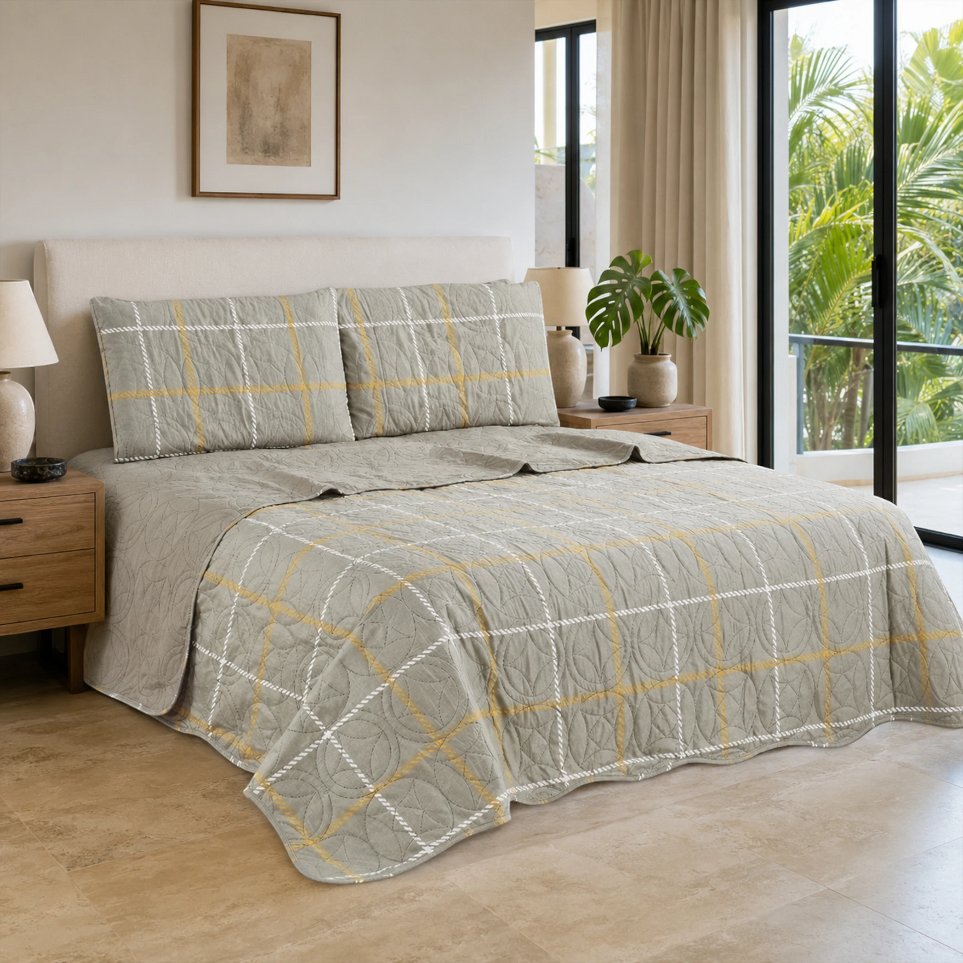 Juego de cubrecama reversible gris con cuadros blancos y mostaza, presentado sobre una cama.
