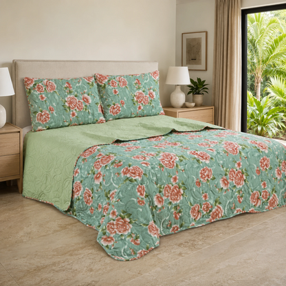 Juego de cubrecama reversible menta con estampado floral coral y reverso verde claro.