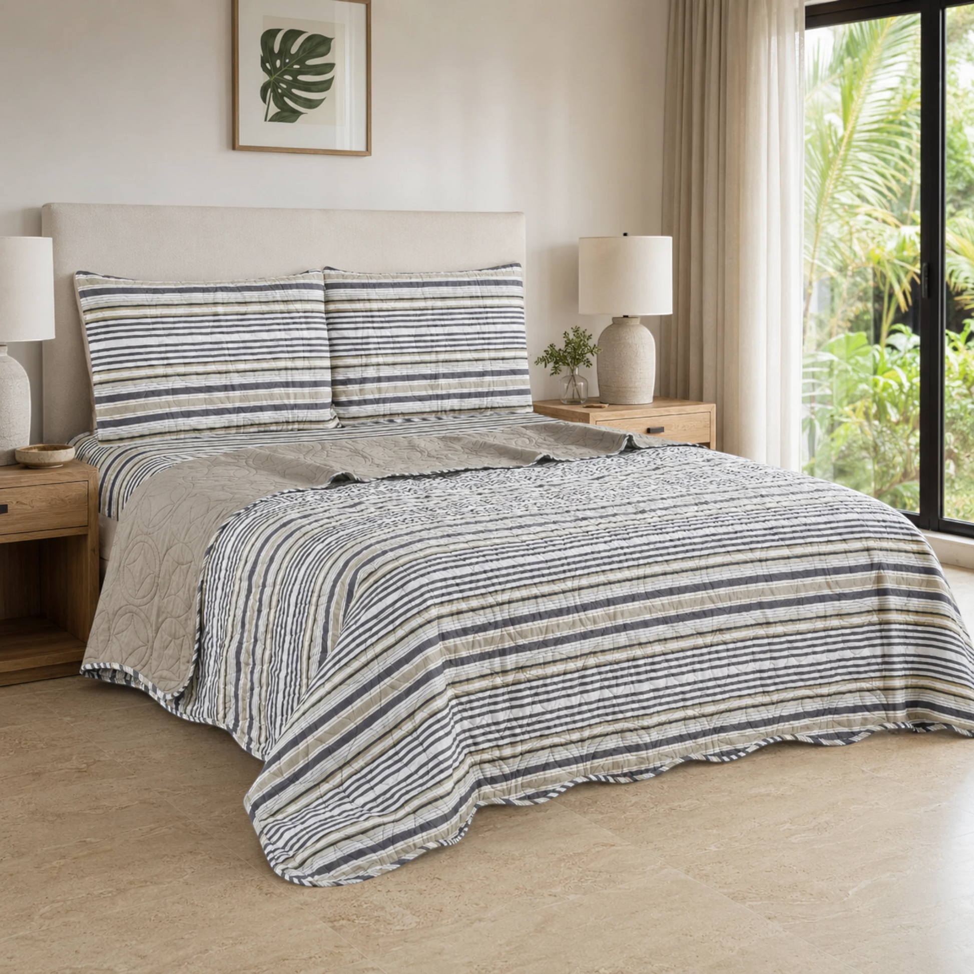 Juego de cubrecama reversible con rayas gris, taupe, blanco y oliva sobre una cama.