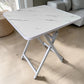Mesa plegable multiusos Ambienta Home Decor color blanco tipo mármol con estructura blanca, medida 60x60 cm y altura 72 cm, vista frontal lateral, SKU 41346.