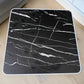 Vista superior de mesa plegable multiusos Ambienta Home Decor color negro tipo mármol de 60x60 cm con borde blanco, SKU 41345.