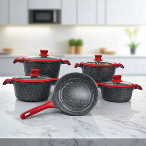Set de batería de cocina NSFE Granite Professional de 17 piezas color negro, vista frontal con ollas y sartén sobre encimera moderna.