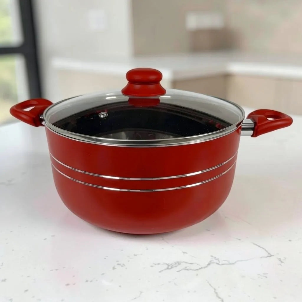 Olla ROCA roja antiadherente con tapa de vidrio y asas laterales resistentes.