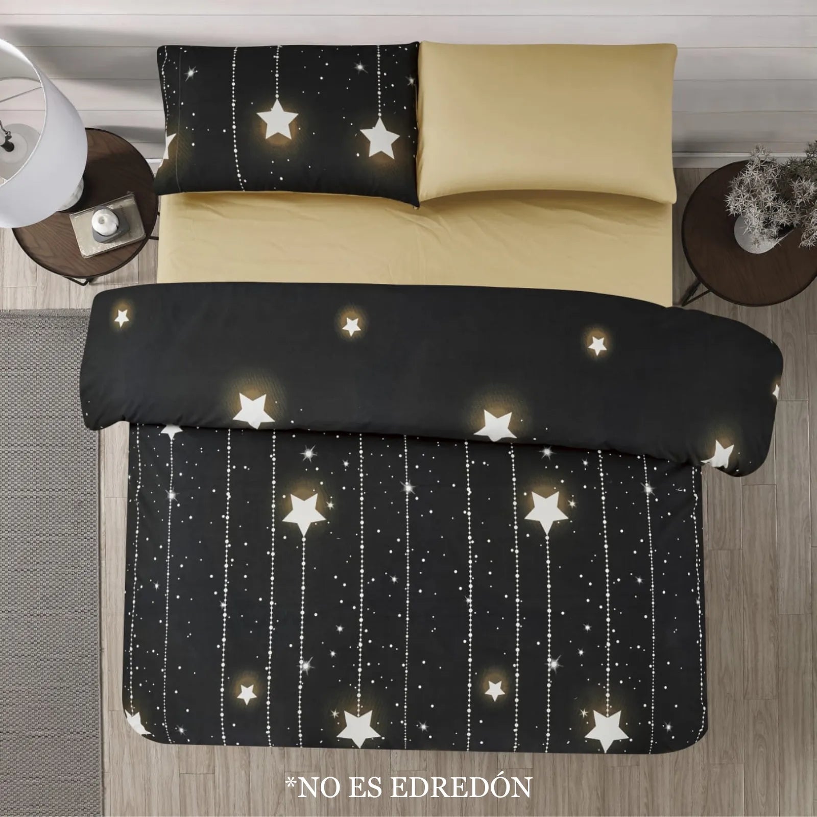 Sábanas Dania Coco con diseño de estrellas sobre fondo negro y beige, estilo nocturno, vista superior