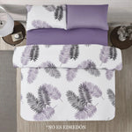 Sábanas Dania Coco con estampado de hojas tropicales en negro y morado sobre fondo blanco