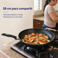 Sartén grande Caracol de 28 cm sobre cocina de gas con pollo y vegetales, ideal para preparar comidas familiares.