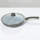 Sartén ROCA color gris con tapa de vidrio templado, interior cerámico blanco y mango ergonómico gris.
