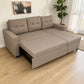 Sofá cama 2 en 1 Ambienta Home Decor color taupe con extensión deslizable parcialmente abierta, mecanismo metálico visible, chaise izquierda y amplia superficie para descanso en sala moderna.