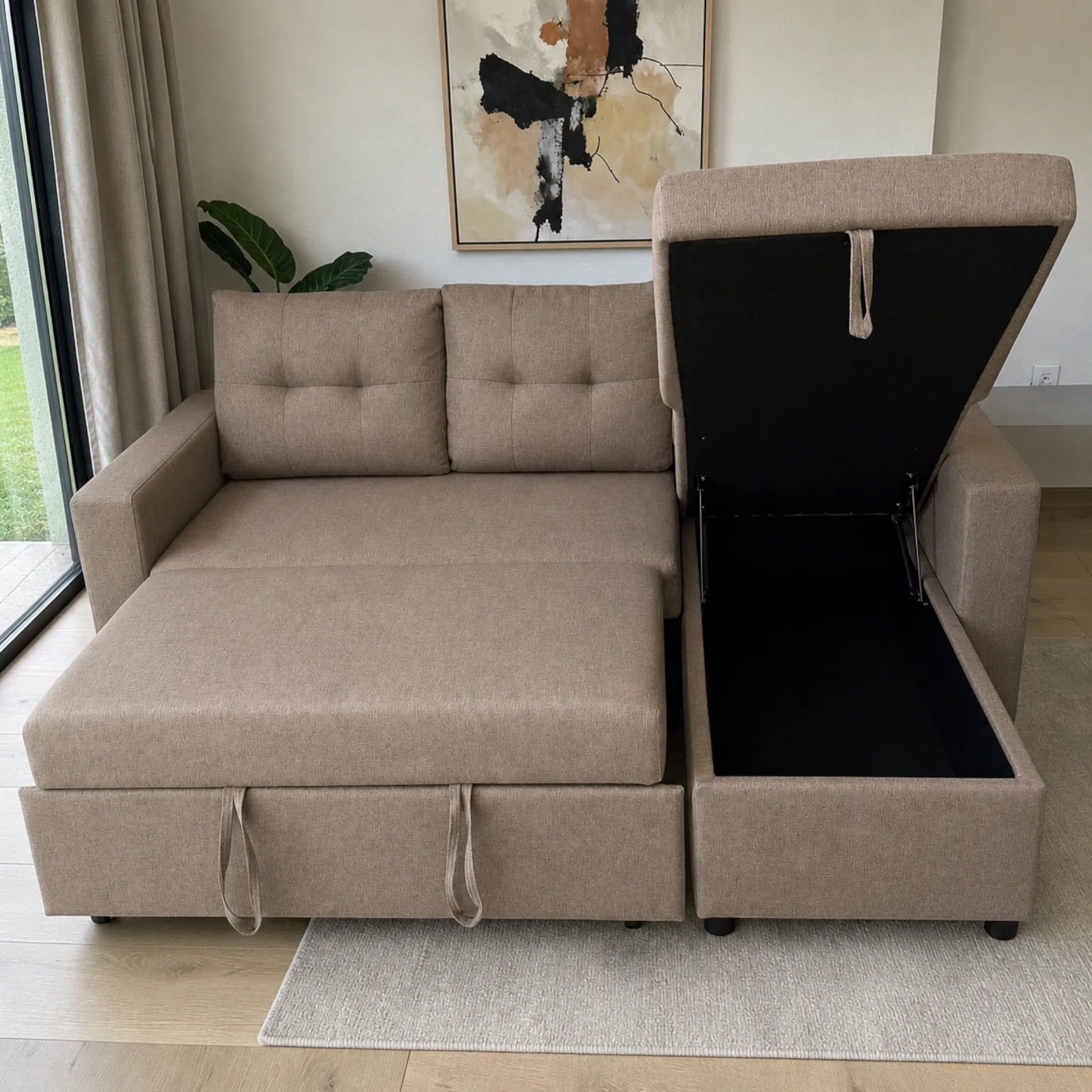 Sofá cama taupe con cajón de almacenamiento abierto en chaise derecha, tapa levantada, interior negro amplio, brazos rectos y respaldos acolchados.
