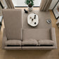 Vista superior del sofá cama taupe con cajón de almacenamiento abierto, tres cojines removibles, brazos rectos y diseño convertible para sala moderna.