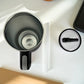 Vista superior de termo de acero inoxidable negro con tapa de rosca y pajilla incluida, capacidad 1200 ml.